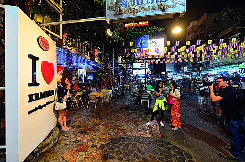 Street food vendor grilling skewers on Khao San Road
