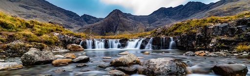 Hiking trail to the Fairy Pools with Cuillin peaks in the distance