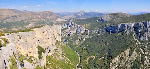 Hikers walking above the Verdon Gorge on a limestone trail