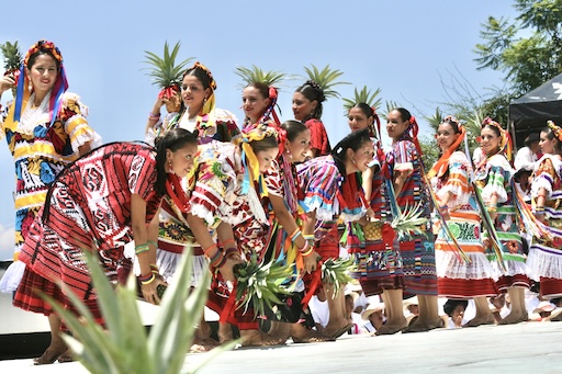 Guelaguetza parade with traditional giant puppets