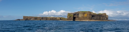 Sharp basaltic cliffs of Staffa meeting the Atlantic Ocean