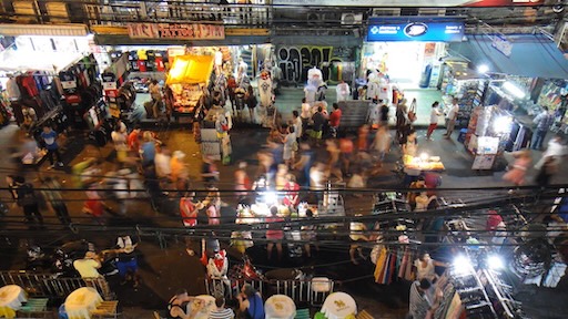 Young travelers partying with neon drinks at Khao San Road