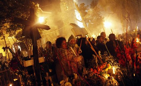 Mixquic cemetery full of candlelit graves