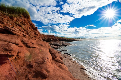 Coastal view of Prince Edward Island with red cliffs and sea