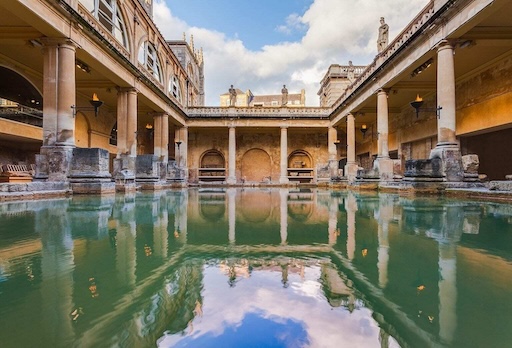 Steam rising from the Great Bath with Roman statues above
