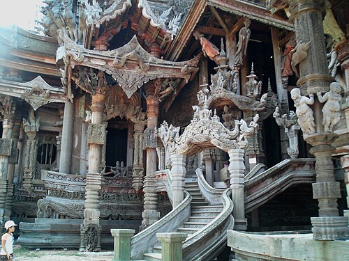 Woodworkers carving statues at the Sanctuary of Truth