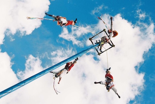 Voladores flying in traditional dress