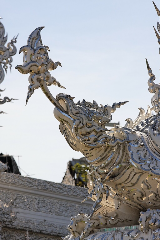 Silhouette of White Temple at sunrise with peaceful surroundings
