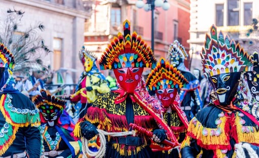 Xantolo musician and masked figure