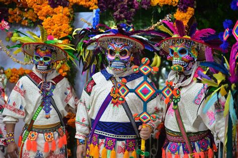 Masked Xantolo dancer in colorful attire