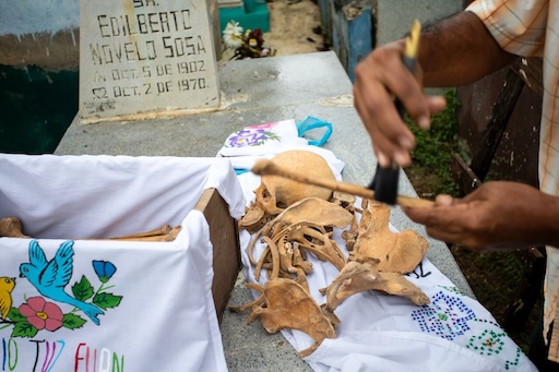 Boxes of bones stacked in Pomuch cemetery niches